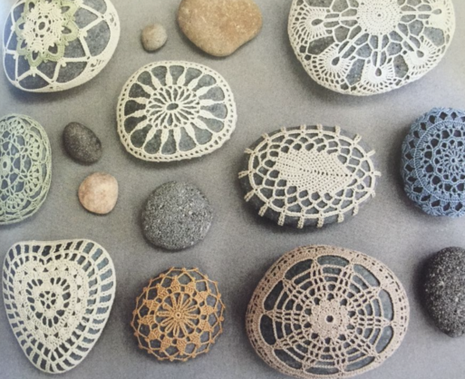 Crocheted memory stones in various designs, including hearts and flowers.