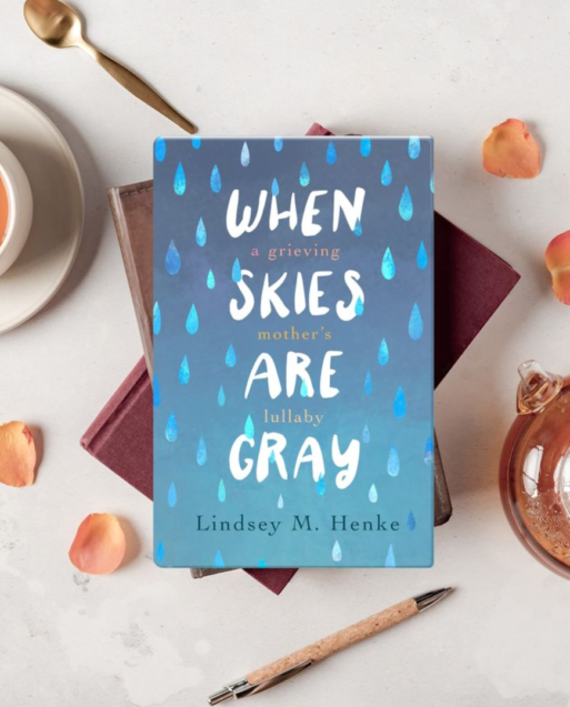 Photograph of a book with a light blue cover and the title: When Skies Are Gray