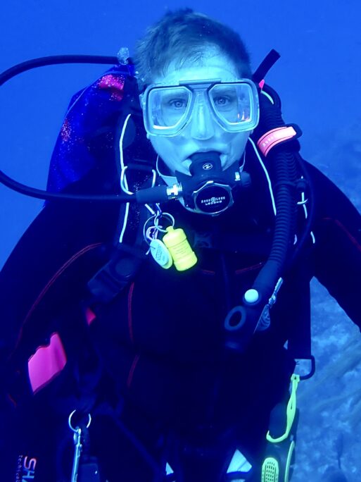 Dr. Marianne Matzo under the water in scuba gear.