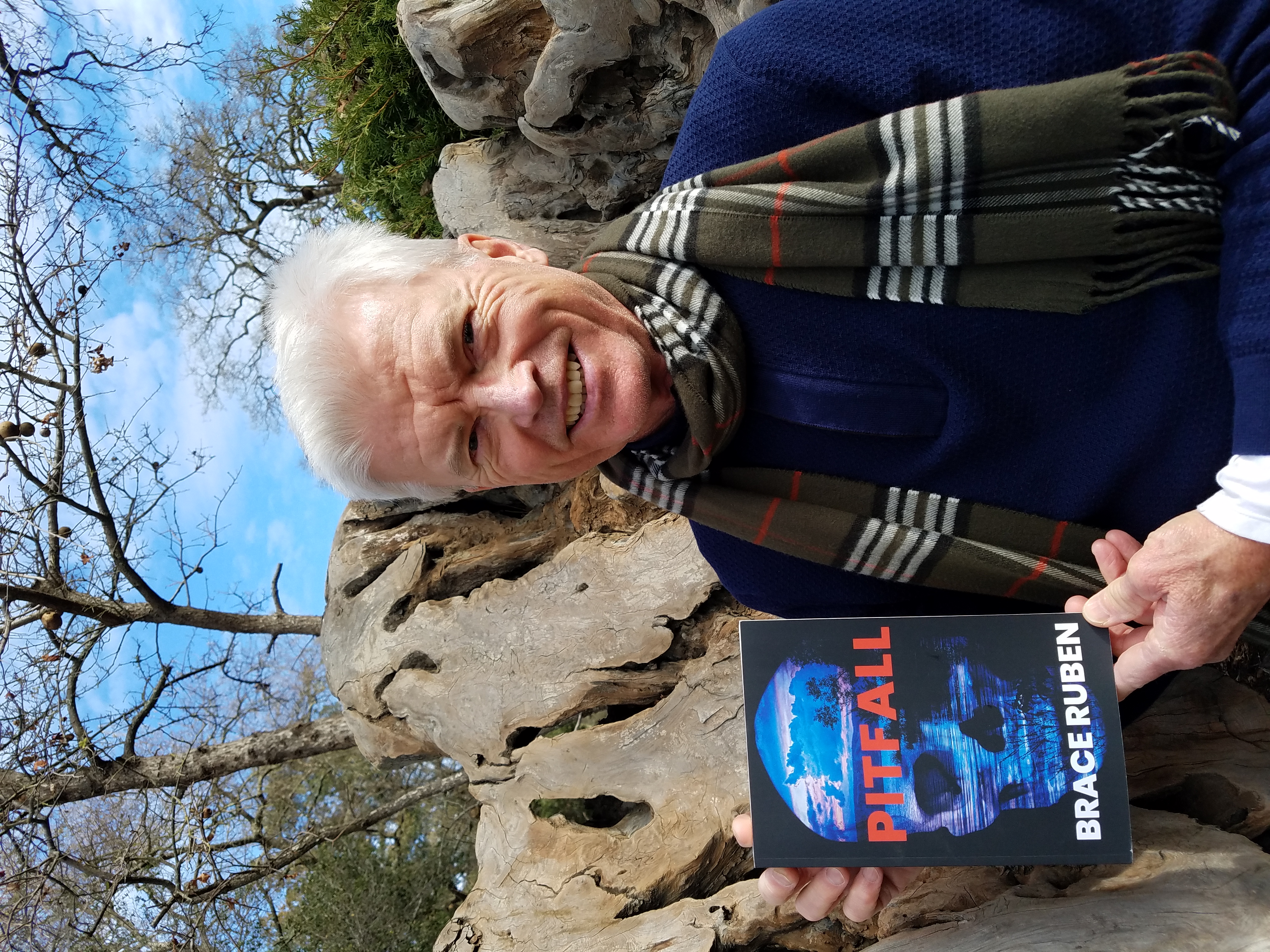 Bruce Koepp posing with his novel.