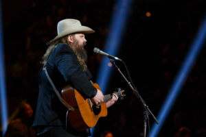 Picture of Chris Stapleton performing with an acoustic guitar 