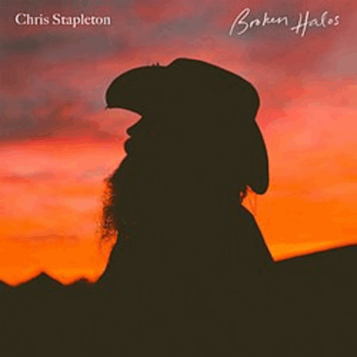 The silhouette of a man with a long, straggly beard and a cowboy hat is shown in front of a red and orange sunset