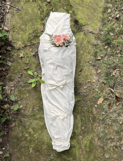 Eco Shroud wrapped around a body laying on the ground