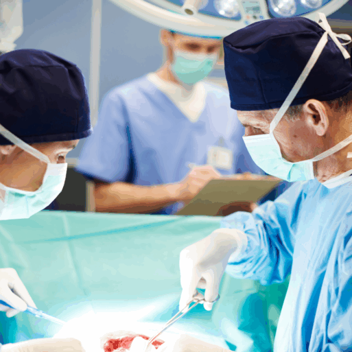 Two surgeons are operating on a patient, while a nurse is in the background writing something on a notepad. 