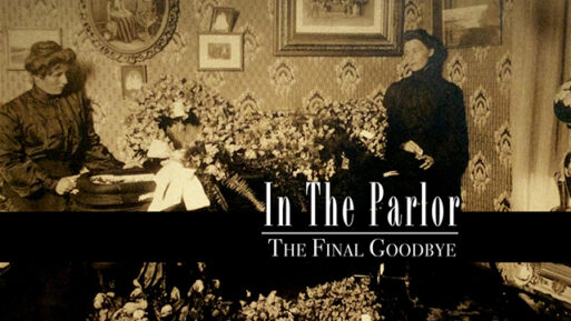 Two women surround a coffin in a sepia-toned, antique photo. The title of the documentary the image represents: "In the Parlor: The Final Goodbye" is written in white.
