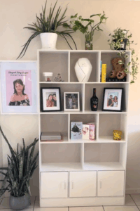 White bookshelf housing an altar honoring a teen who died.