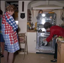 Grandmother cooking in the kitchen as remembered by her grand daughter