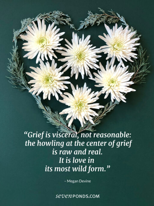 flowers and branches arranged in a heart shape