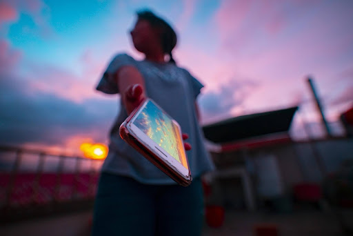 person holding out smartphone