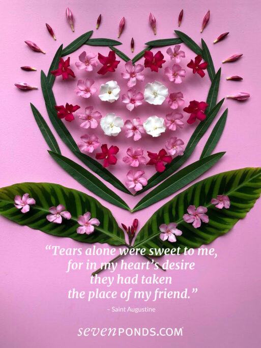 An image of a heart in pink and red made of flowers with a sweet saying for valentine's day