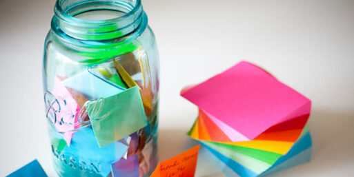 a mason jar with colorful notes as a great gift of handwritten memroies for a friend who suffered a lodss