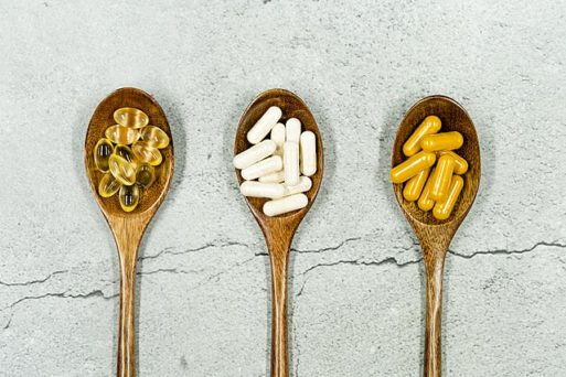 three longevity supplements displayed on spoons