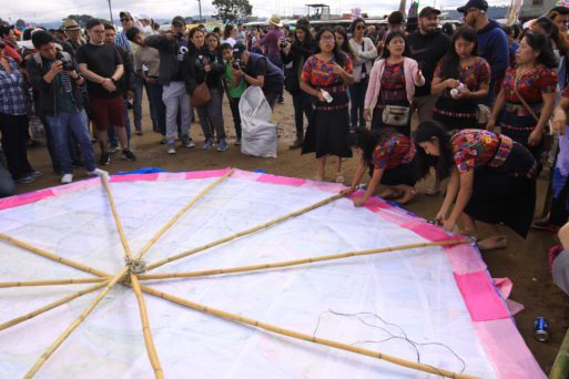 residents gather together to build giant kites