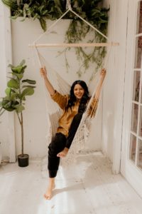 Shanila Sattar, author of "Breathe," poses in a hammock swing.